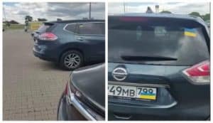 Россияне в Польше начали прятать флаг на номерах машин, наклеивая флаг Украины